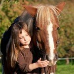 Young girl with a horse.